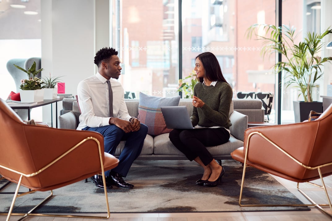 Woman Interviewing Job Applicant 